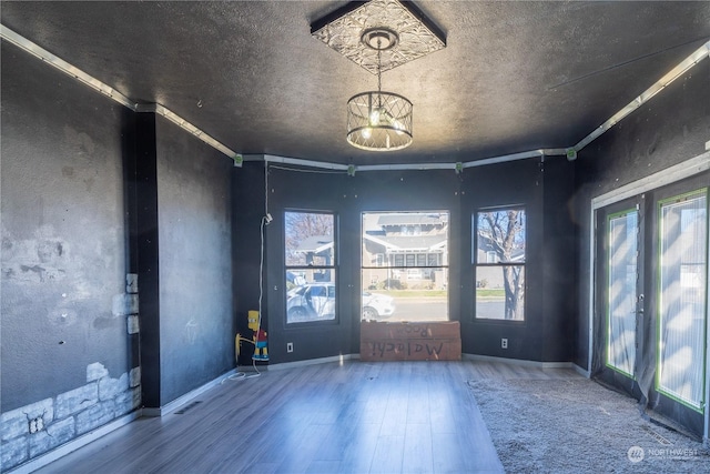 unfurnished room featuring hardwood / wood-style floors and crown molding