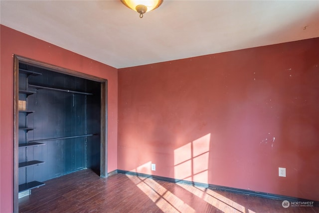 spare room featuring hardwood / wood-style flooring