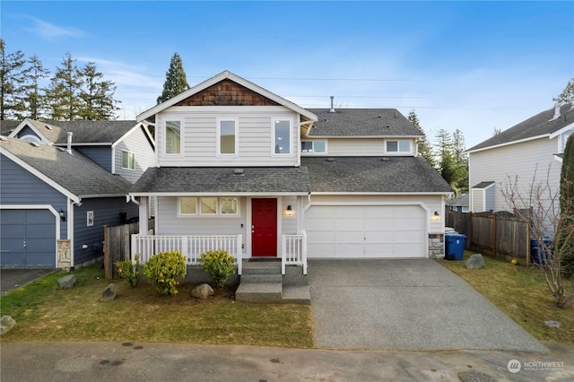 front of property featuring covered porch and a garage