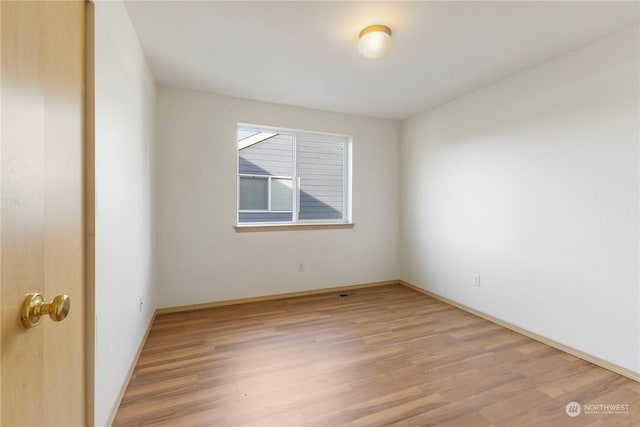 empty room with light wood-type flooring