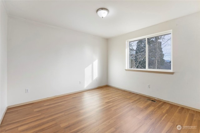 empty room featuring wood-type flooring