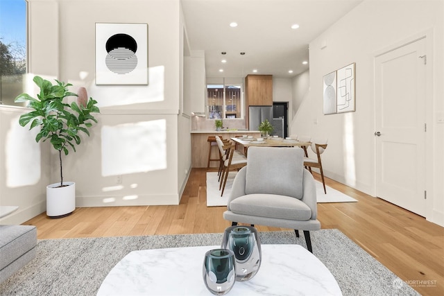 sitting room with light hardwood / wood-style flooring