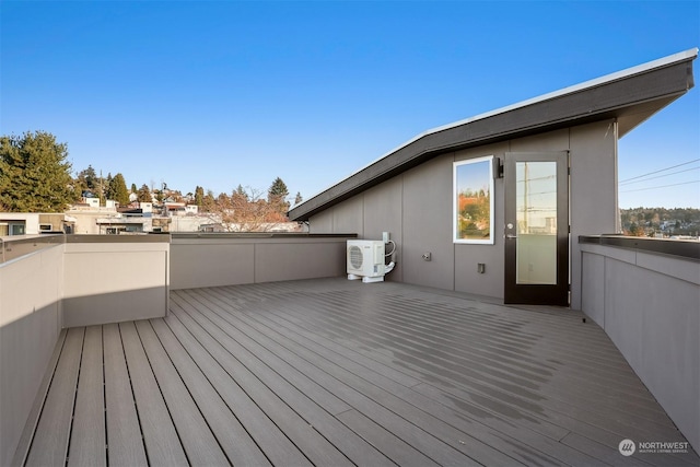 wooden deck featuring ac unit