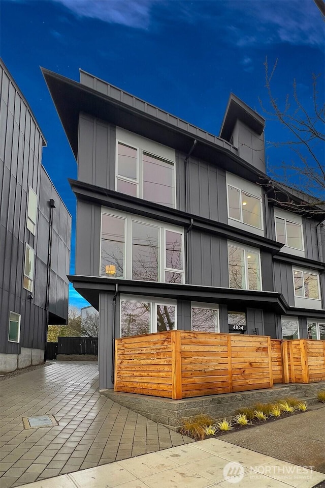 rear view of house with board and batten siding