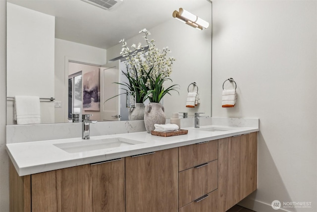 full bathroom featuring double vanity, a sink, and visible vents