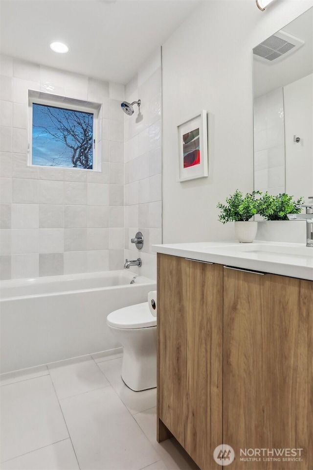 bathroom with shower / bath combination, visible vents, toilet, tile patterned floors, and vanity