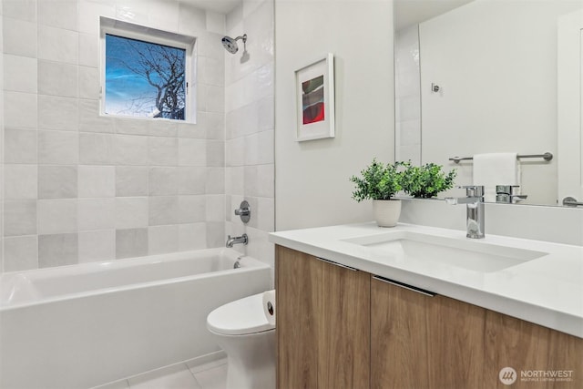 bathroom featuring tile patterned floors, vanity, toilet, and bathing tub / shower combination