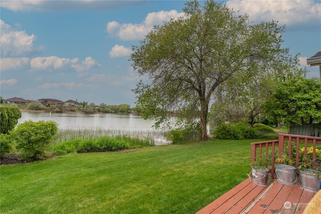 view of yard featuring a deck with water view