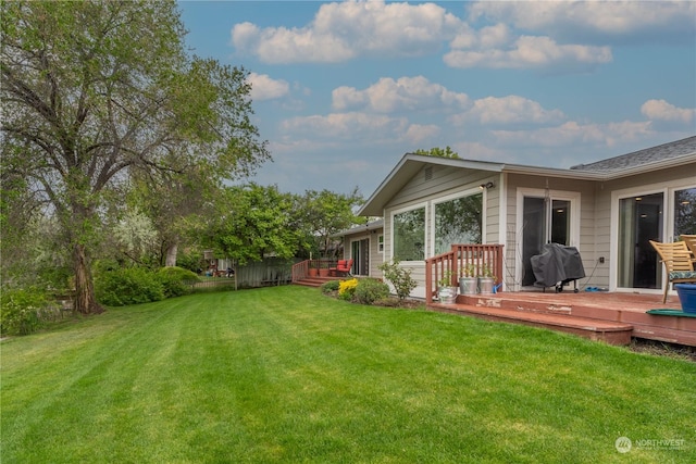 view of yard featuring a wooden deck