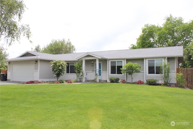 ranch-style house with a garage and a front lawn