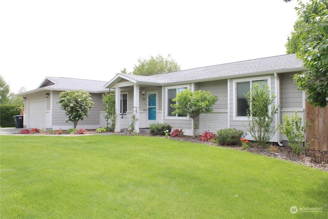 ranch-style home with a garage and a front lawn