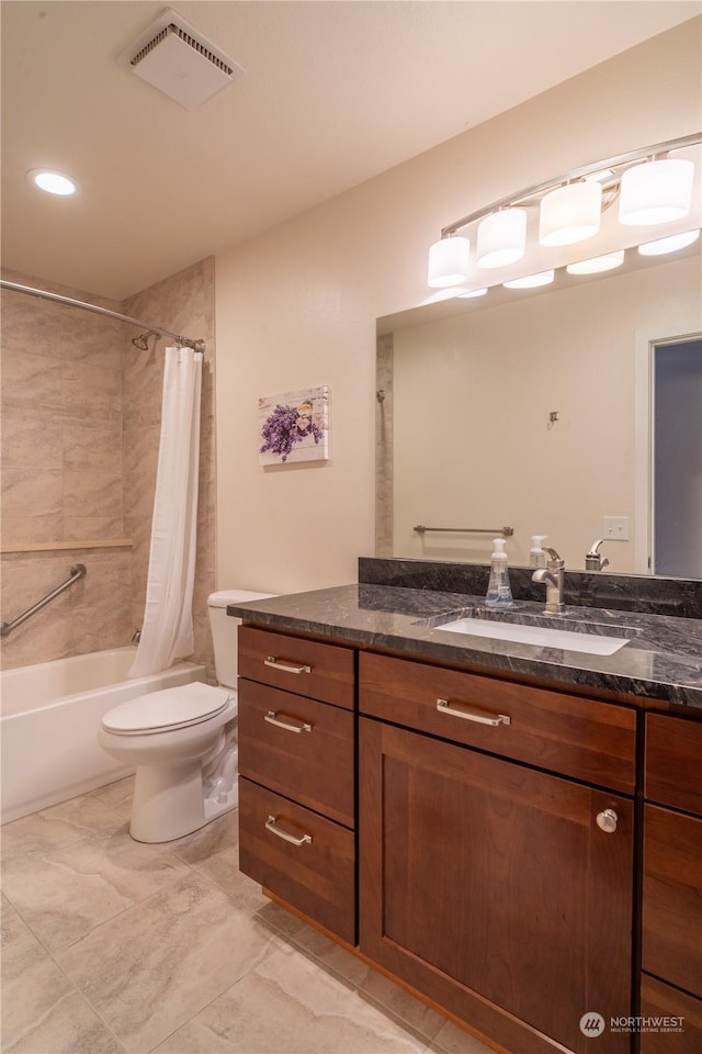 full bathroom featuring vanity, shower / bath combo, and toilet