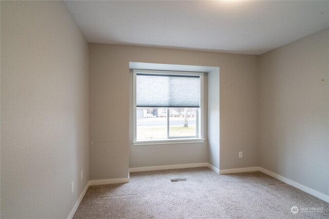 unfurnished room with carpet floors