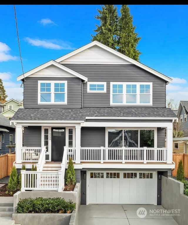 view of front facade featuring a porch and a garage