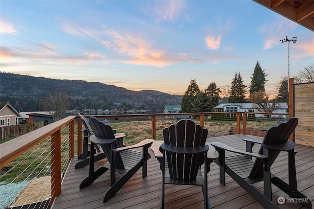 deck at dusk with a mountain view