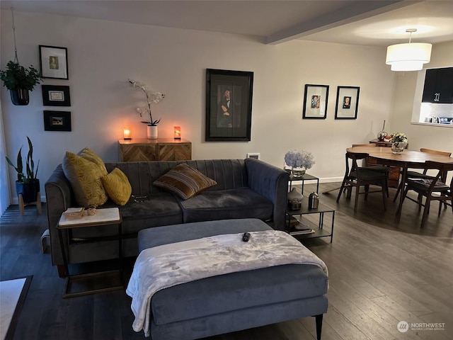 living room with beam ceiling and dark hardwood / wood-style flooring