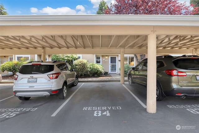 view of parking / parking lot with a carport