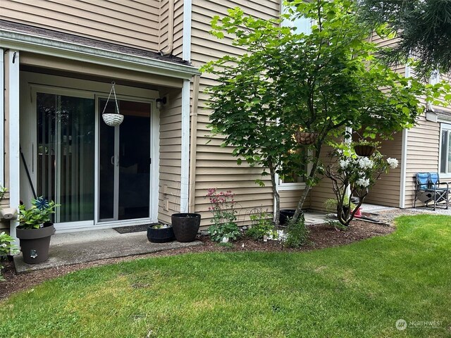 view of home's exterior with a lawn