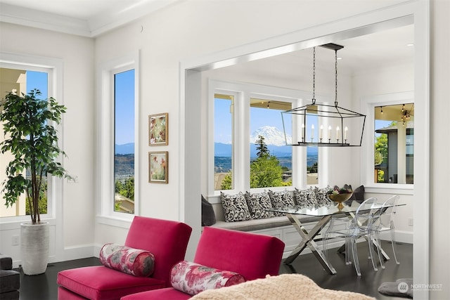 interior space with crown molding and a mountain view