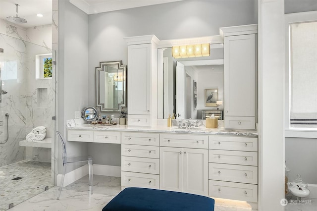 bathroom featuring a shower with shower door and vanity