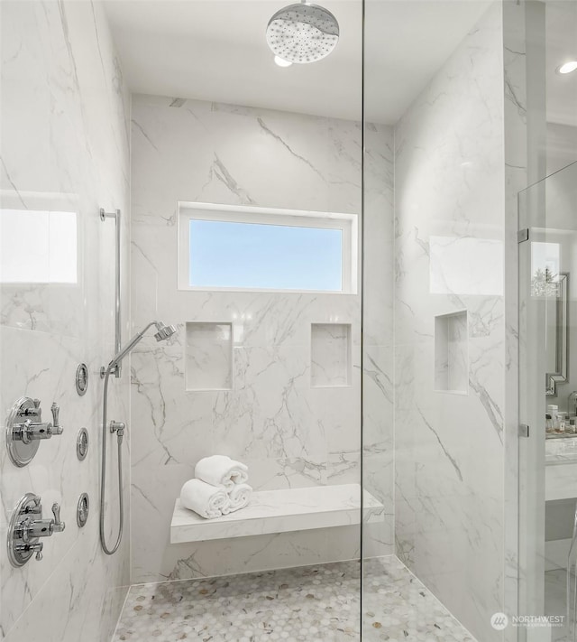 bathroom featuring a tile shower