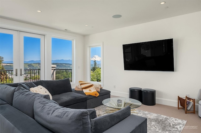 living room featuring french doors and carpet flooring