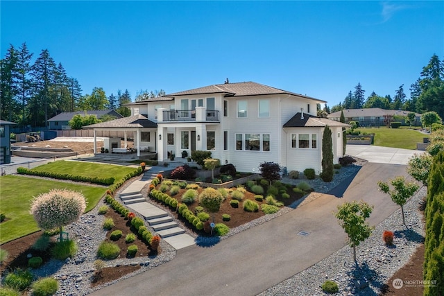 view of front of property with a balcony