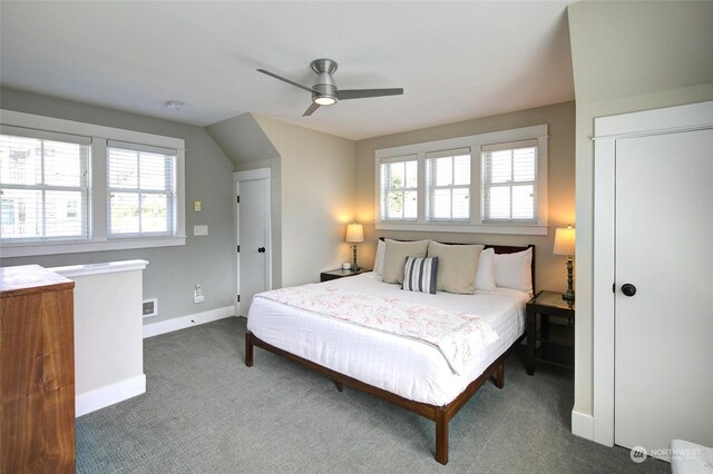 bedroom with a ceiling fan, carpet flooring, and baseboards