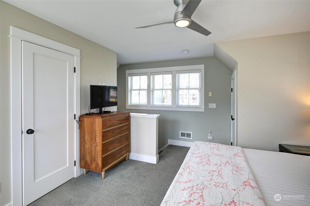 carpeted bedroom with baseboards, visible vents, and ceiling fan