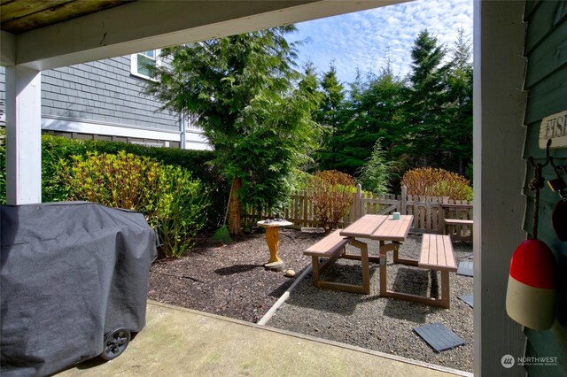 view of yard with outdoor dining space, a patio area, and fence