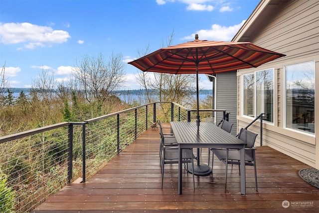 wooden deck featuring a water view