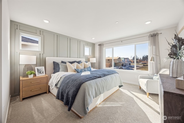 bedroom featuring light carpet