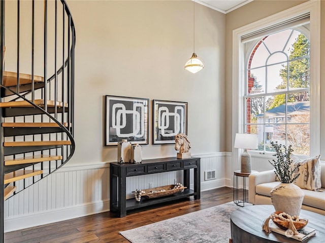 sitting room with crown molding and dark hardwood / wood-style flooring