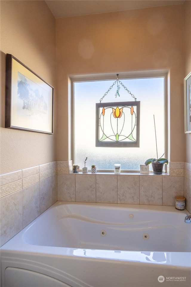 bathroom with a tub to relax in