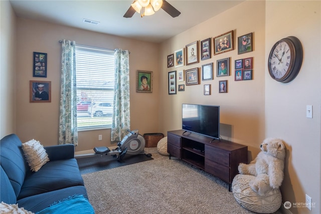 living room with light colored carpet and ceiling fan