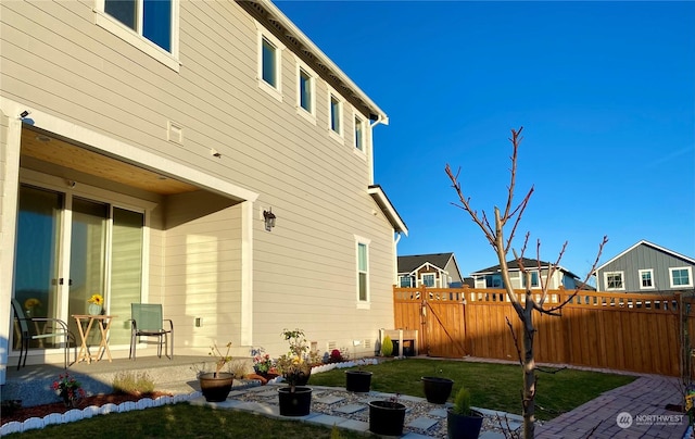 view of side of property with a patio area