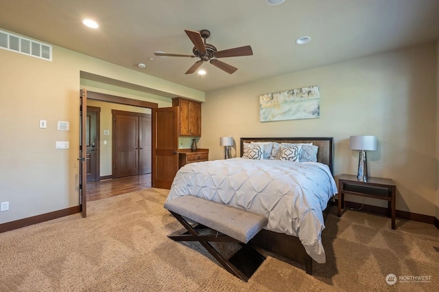 carpeted bedroom with ceiling fan