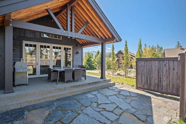 view of patio / terrace featuring a grill and french doors