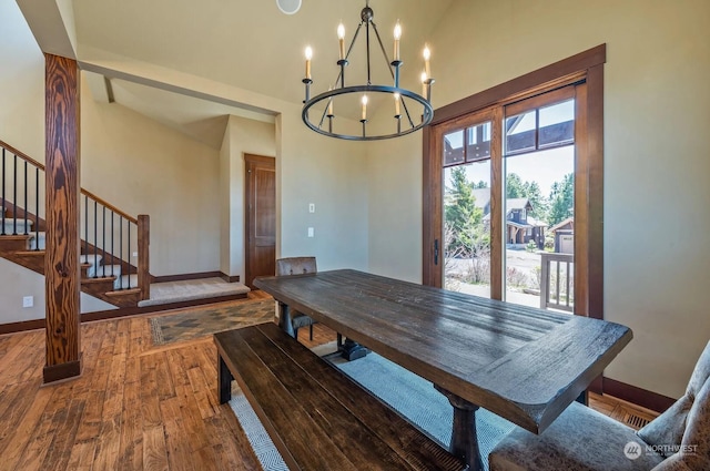 dining area with a notable chandelier and wood-type flooring