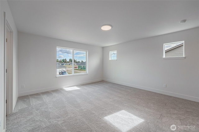 interior space with carpet floors and baseboards