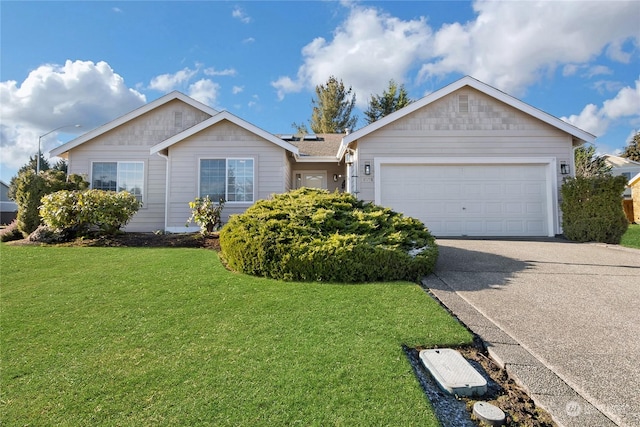 single story home with a front yard and a garage