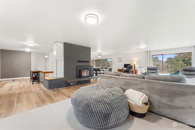 12504 SW 232nd St, Vashon, WA 98070 - living area with healthy amount of natural light, light wood-style floors, and a fireplace