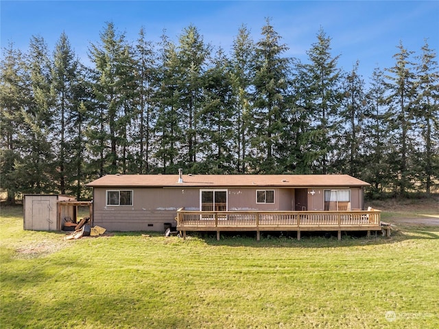 12504 SW 232nd St, Vashon, WA 98070 - rear view of house featuring crawl space, a lawn, a wooden deck, and a shed