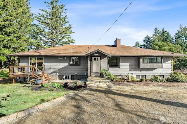 12504 SW 232nd St, Vashon, WA 98070 - ranch-style house with a chimney and a wooden deck