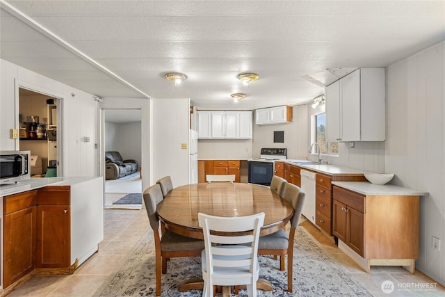 dining area featuring light tile patterned flooring