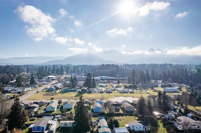 birds eye view of property featuring a mountain view