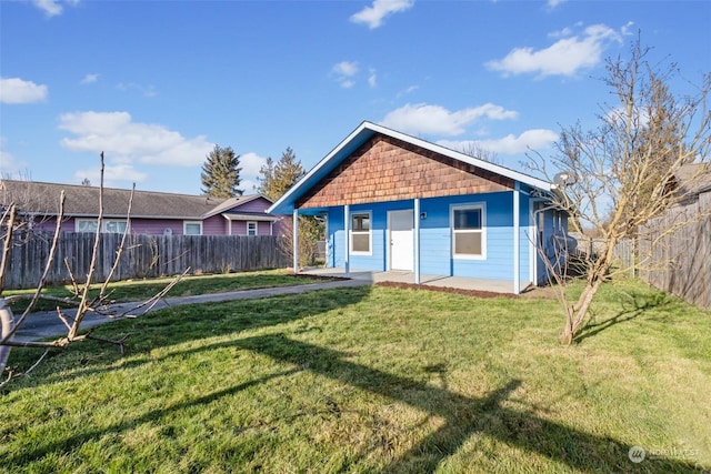 exterior space with a patio area and a front yard