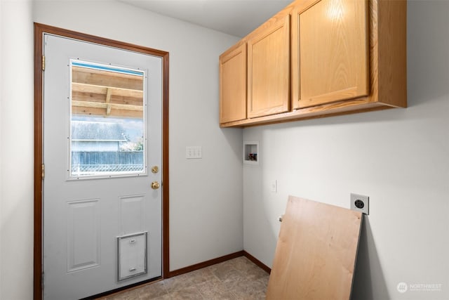 laundry area featuring hookup for a washing machine, hookup for an electric dryer, and cabinets