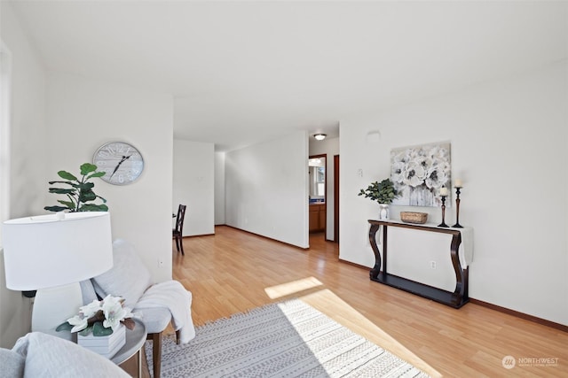 sitting room with hardwood / wood-style flooring