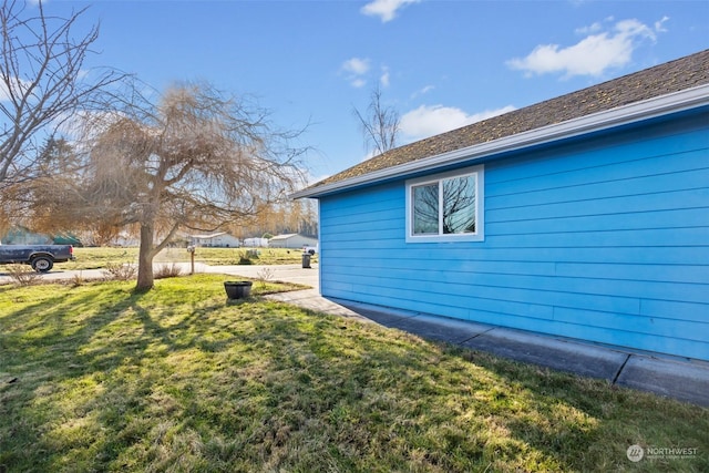 view of home's exterior featuring a lawn